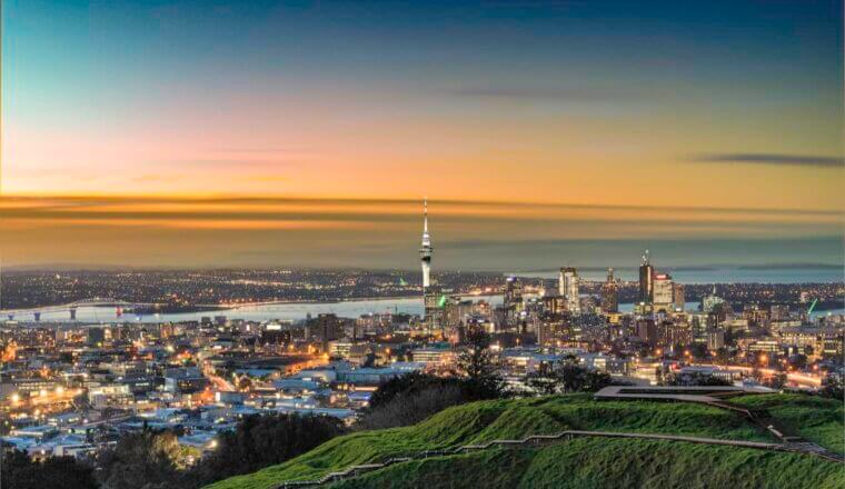 The stunning skyline of Auckland, New Zealand during a colorful dusk sunset