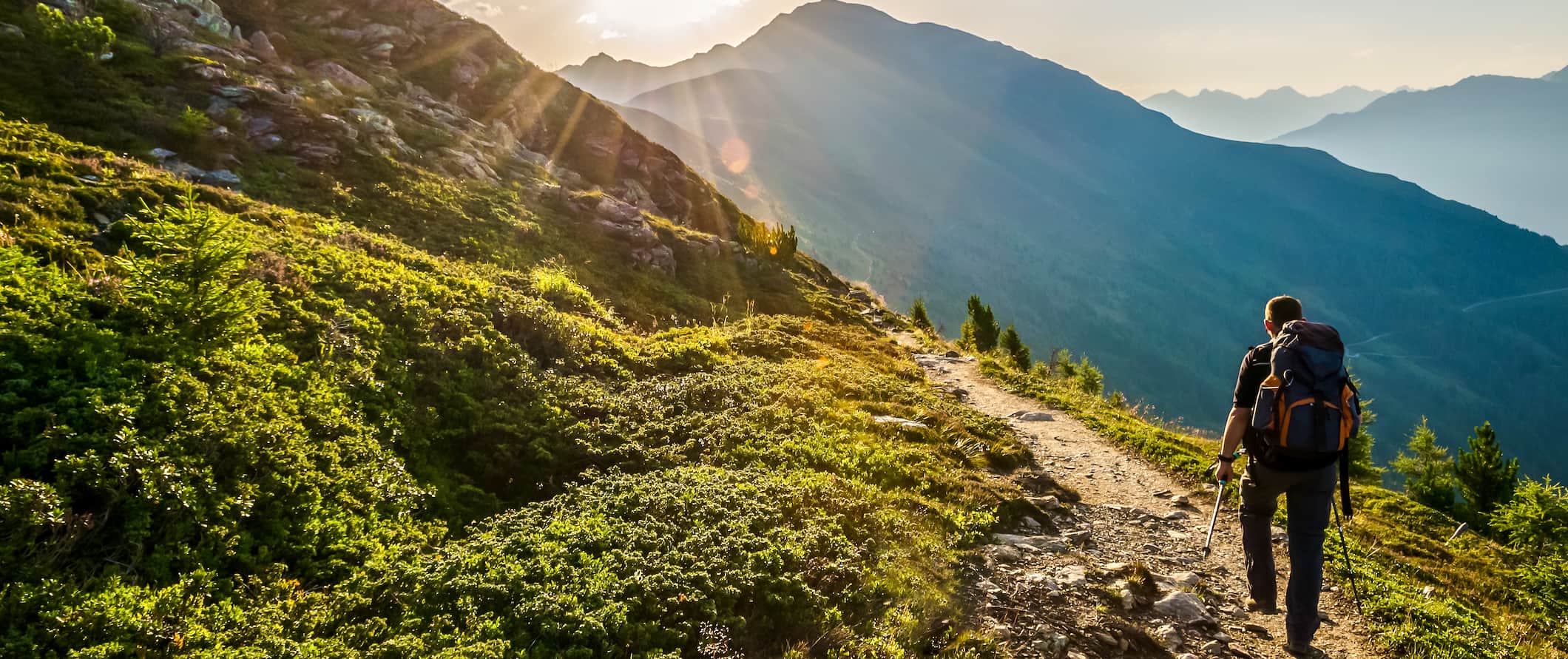 A solo hiker exploring the rugged hills and mountains of Austria