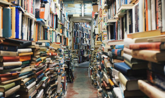 a hallway of colorful stacked books