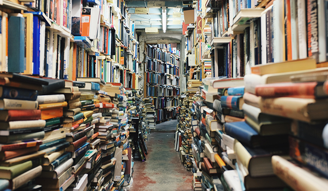 a hallway of colorful stacked books