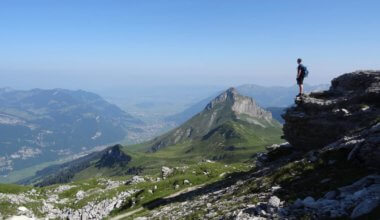 A solo traveler looking out over mountains