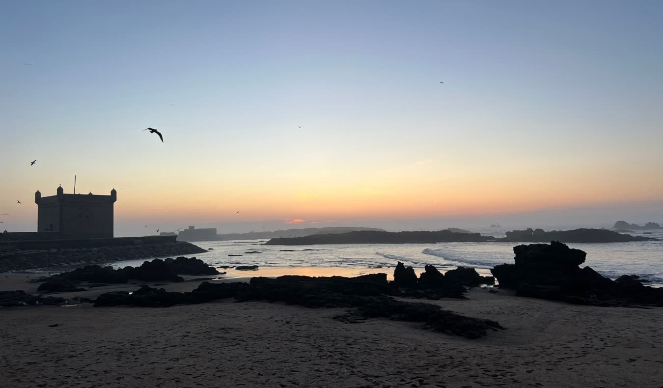 Sunset over the water in Essaouria, Morocco