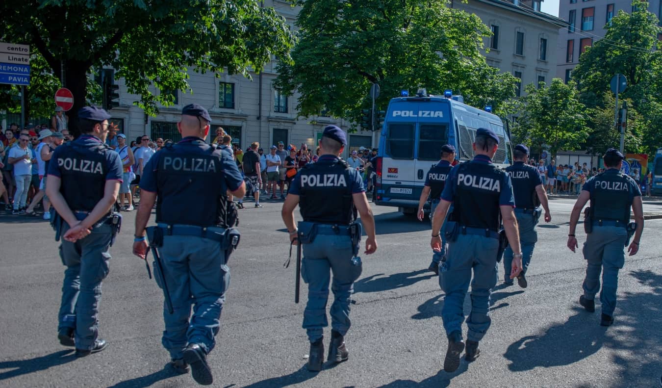 Police walking down the street in Milan, Italy