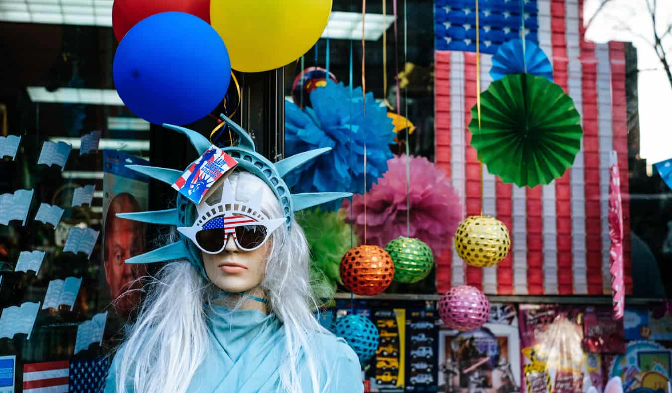 A woman dressed up like the Statue of Liberty