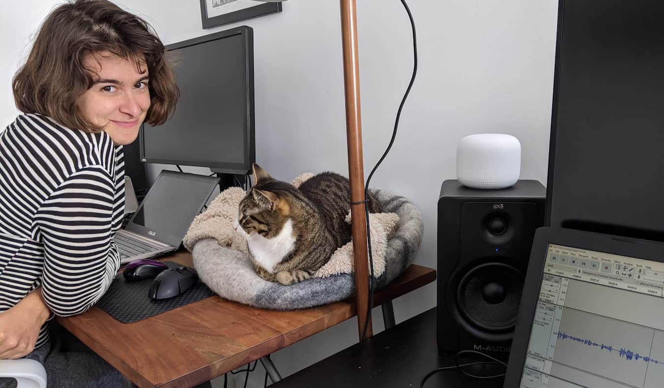 Sam, the lead researcher for Nomadic Matt, posing with a cat while house sitting abroad