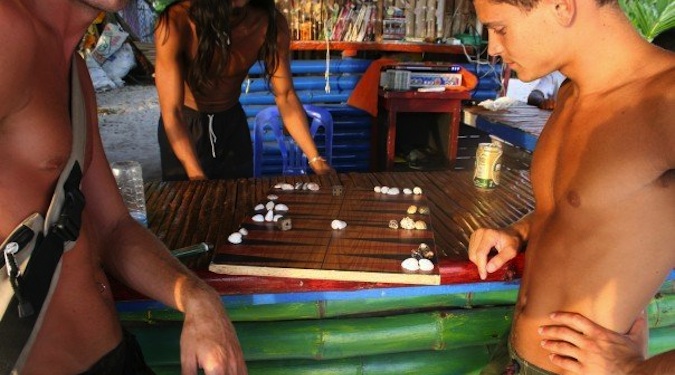 Nomadic Matt playing games on beach