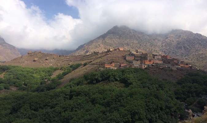 Small houses dotting the side of a mountain in Morocco