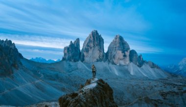 person on top of a mountain during dusk