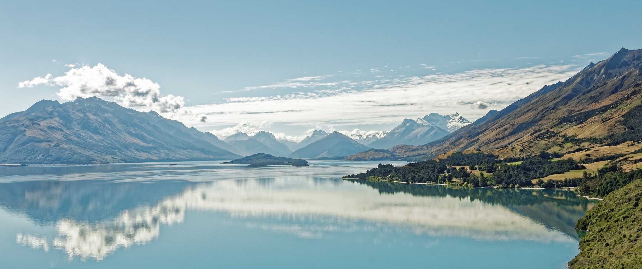 Dramatic landscape with mountains and a large lake in Fiordland National Park, New Zealand.