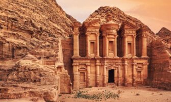 ruins carved in rocky wall at Petra Jordan