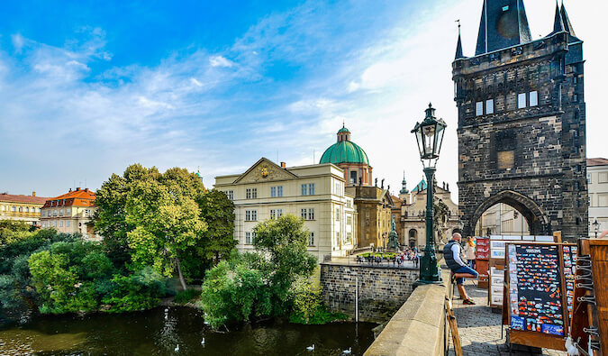 man standing on bridge in Prague