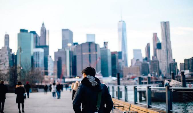 A guy walking alone in NYC