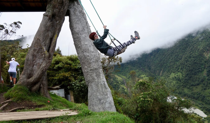 Staci on a swing high in the mountains