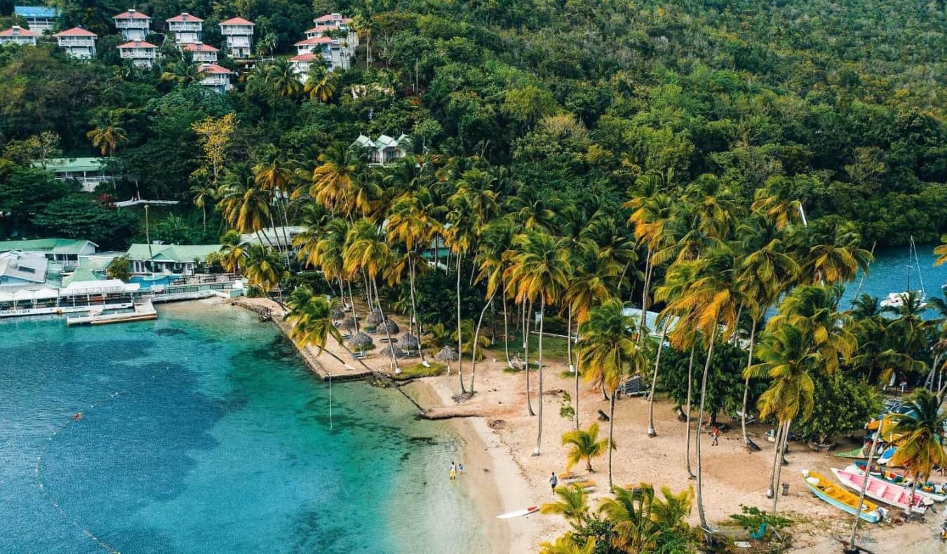 Beautiful blue water and a massive green hill in Saint Lucia