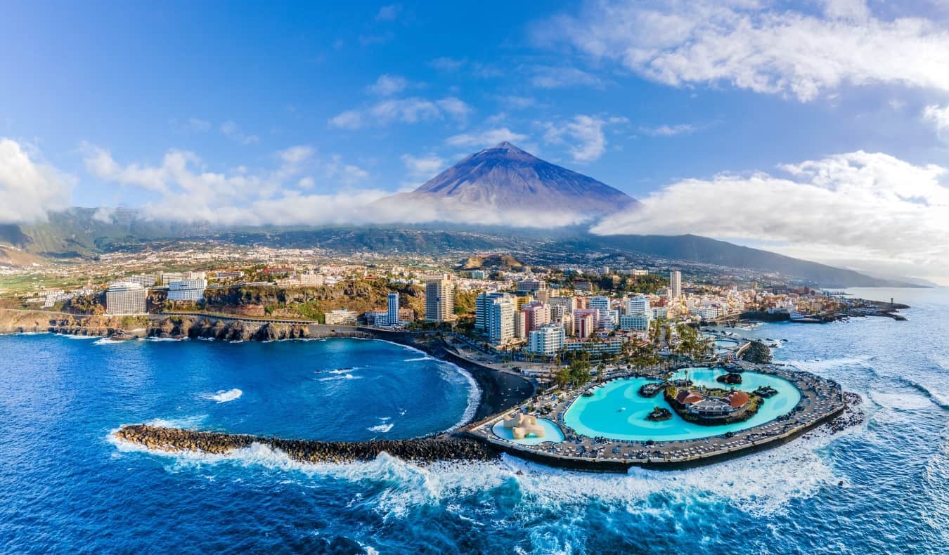 Aerial view with Puerto de la Cruz, in background Teide volcano, Tenerife island, Spain