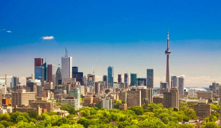 The towering skyline of Toronto, Canada on a bright and sunny summer day