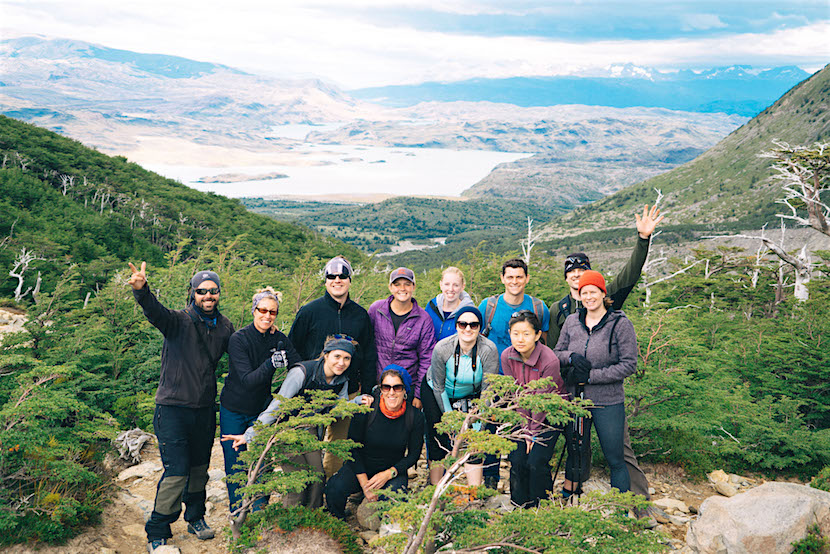 tour group posing with Nomadic Matt during a hike in the hills