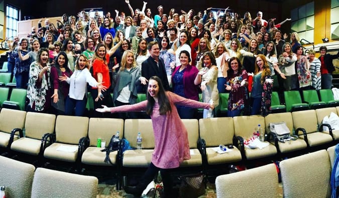 Best-selling author Vanessa Van Edwards posing with her audience